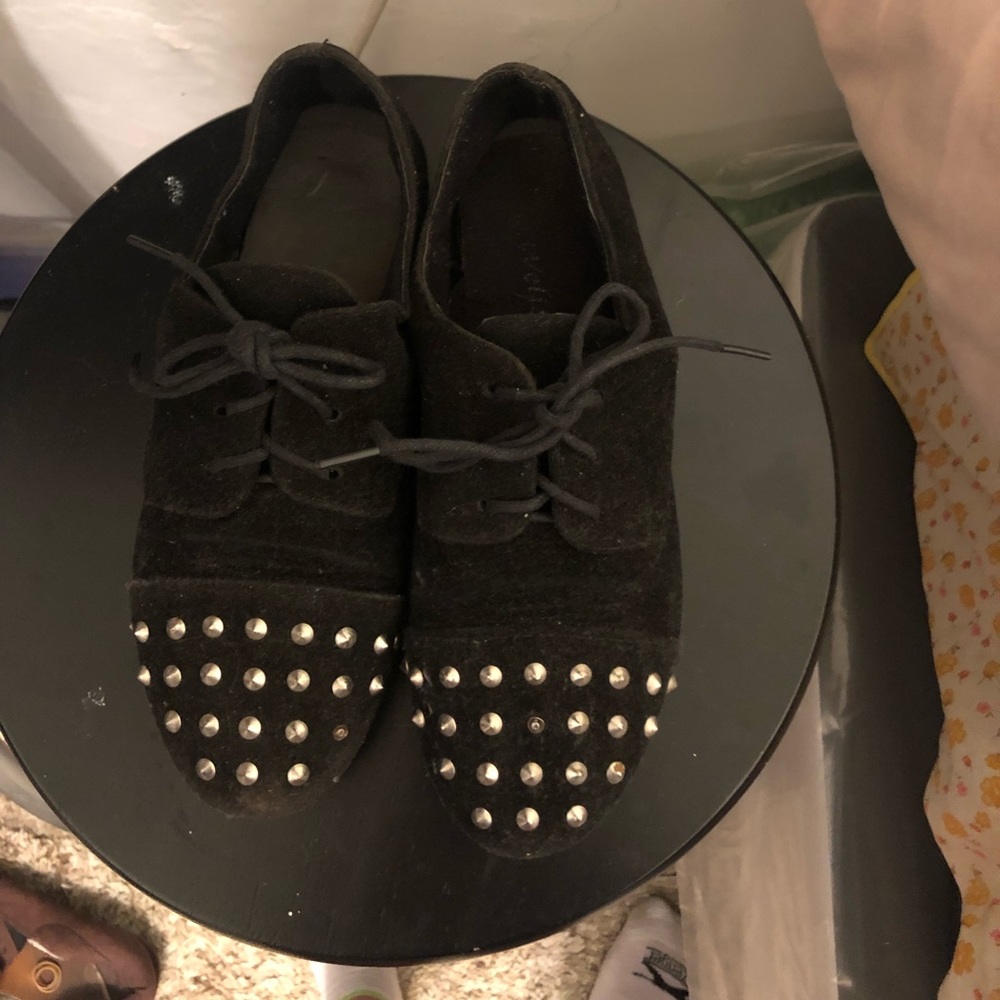 Lightly worn black studded flats